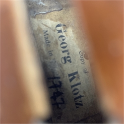  Late 19th century violin with 36cm maple back and spruce top, bears label 'Copy George Klotz Made in 1747', L59cm overall, in ebonised wooden carrying case with two bows  
