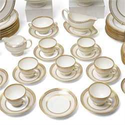 Wedgwood 'Colonnade' pattern dinner and tea service comprising twelve dinner plates, twelve dessert plates, nine soup bowls and stands, pair of covered vegetable dishes, sauce boat and stand, eight tea cups and saucers, thirteen tea plates, milk jug and sugar bowl