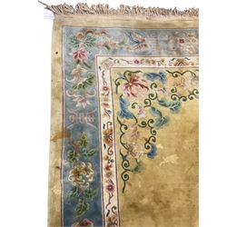 Large Chinese washed woollen carpet, pale sage green ground and decorated with flowers