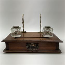 A late Victorian mahogany desk stand, with pen stand, twin glass inkwells and pen tray, above a single drawer, overall H20cm L30.5cm D18.5cm.