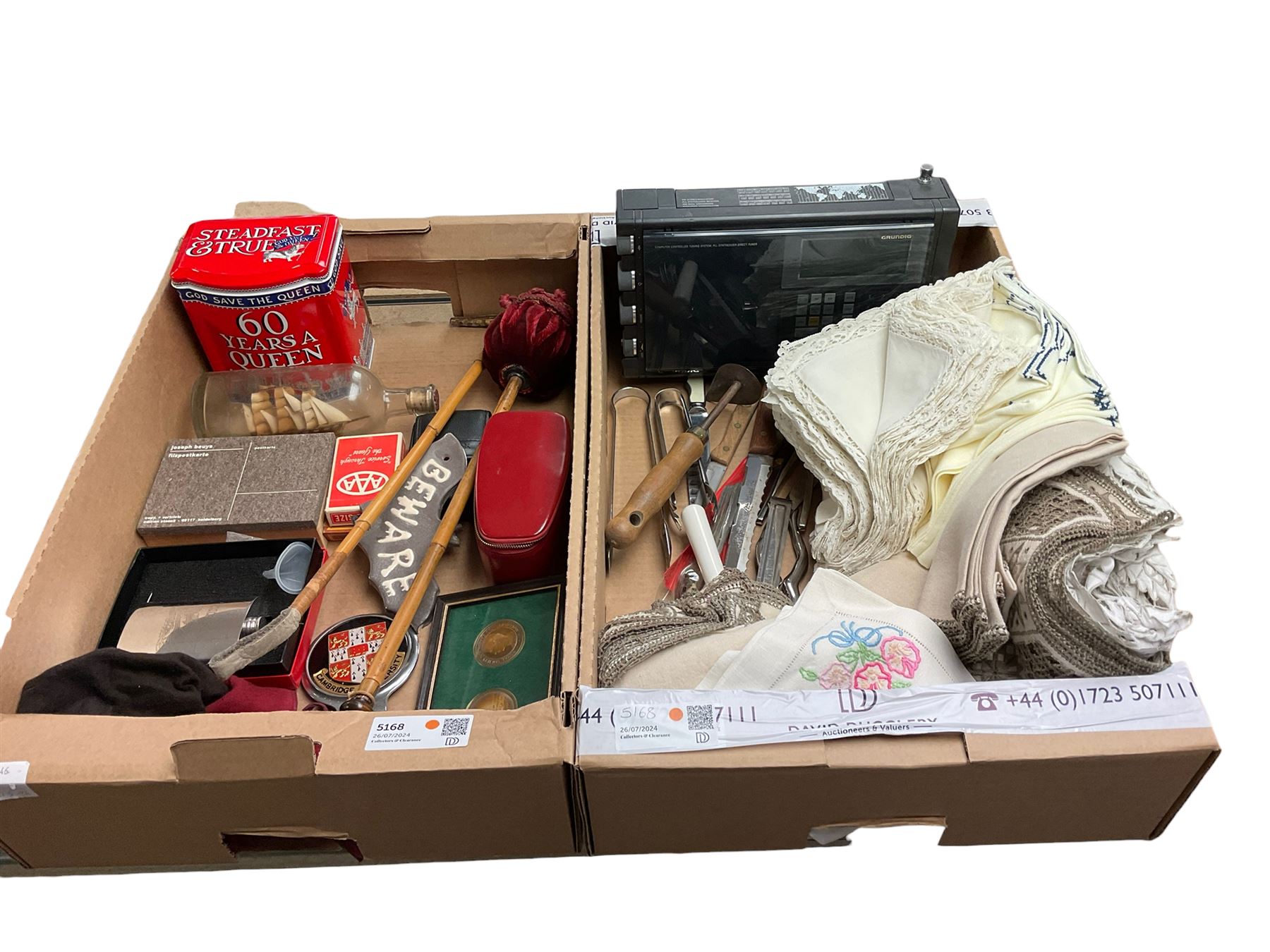 Grundig Satellit 500 radio, table linen, Cambridge University car badge, hip flask, various flatware etc in two boxes