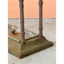 Victorian cast iron stick stand, three divisions raised on reeded columns, over a rectangular base with drip tray (H59cm, W50cm, D26cm) together with a cast iron patio stove on tripod supports. (H41cm) (2) - COLLECTION BY APPOINTMENT FROM: The White House, Thirsk Road, Easingwold, York, YO61 3NF - CALL 01723 507111 TO ARRANGE