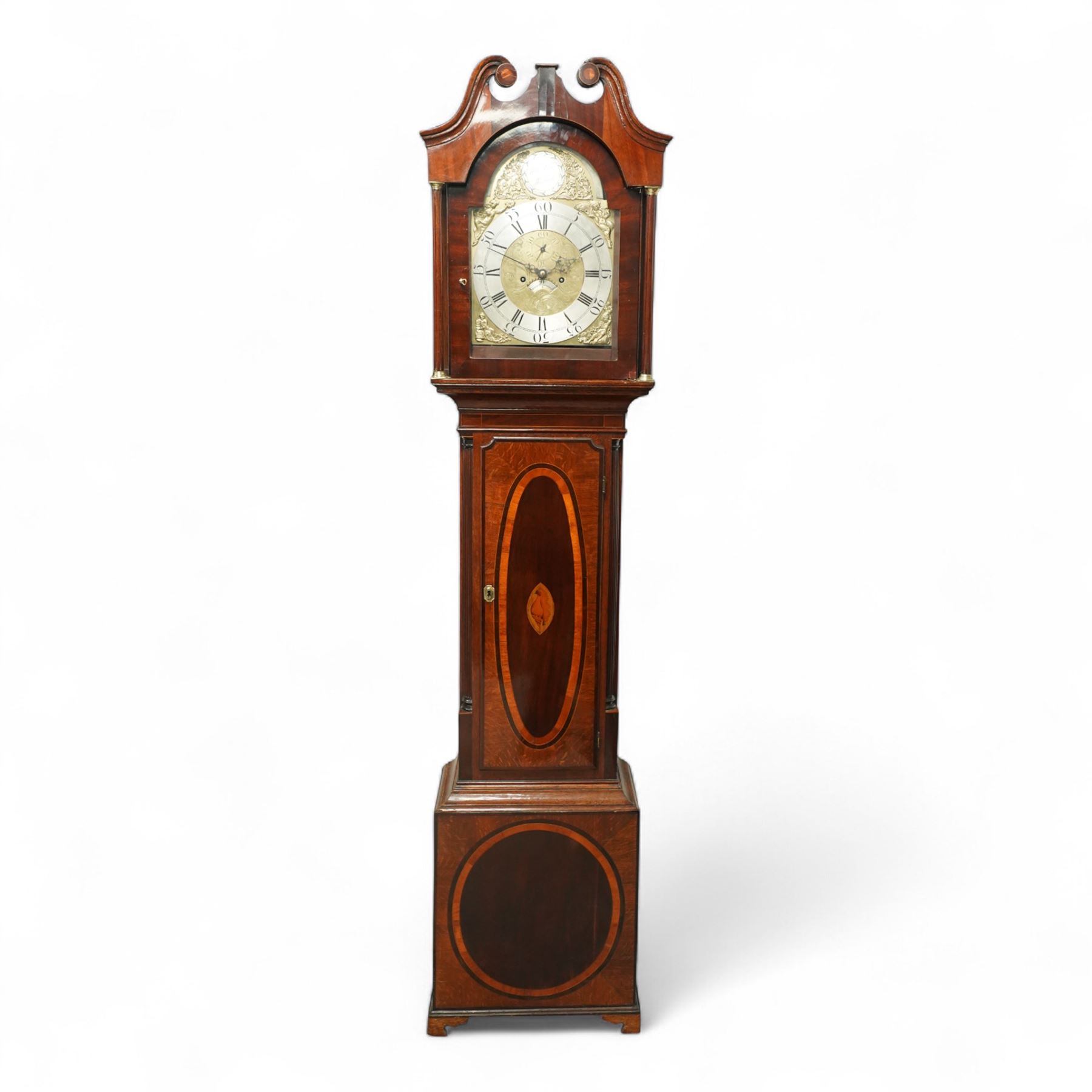 William Vise of Wisbech (Cambridgeshire)-8-day mahogany Longcase clock c1750, with a swan neck pediment and inlaid parterre, break arch hood door beneath flanked by detached reeded pilasters with brass capitals, trunk with conforming pilasters to the corners and an inlaid door with banding to the edge and oval satinwood inlay and matching conche inlay to the centre, conforming pediment with matching circular inlay and raised on bracket feet, brass break arch dial with interesting scroll and floral spandrels to the arch and four season spandrels to the corners, fully engraved dial centre with steel hands, engraved seconds dial and square date aperture, silvered boss to the arch with makers name and conforming chapter with Roman numerals, five minute Arabic's and minute track, dial pinned directly to a two train weight driven rack striking movement, sounding the hours on a bell. With weights and pendulum. 
Both a William and John Vise are recorded as working in Wisbech between 1740 and1758.