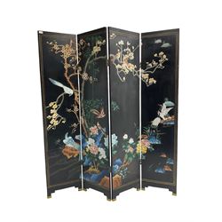 Oriental four fold screen, the black lacquer panels carved and painted with red headed cranes, birds upon blossoming branches and flowers