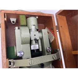 Vickers Instruments England Cooke V22 surveyor's theodolite, No.V.221387, with green enamelled body H32cm; in fitted wooden carrying box with retaining bar and repair label dated 3/8/77.