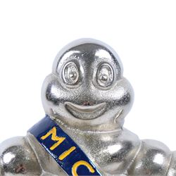 Metal hollow-cast figure, modelled as a Michelin Man stood upon a tire, H26.5cm