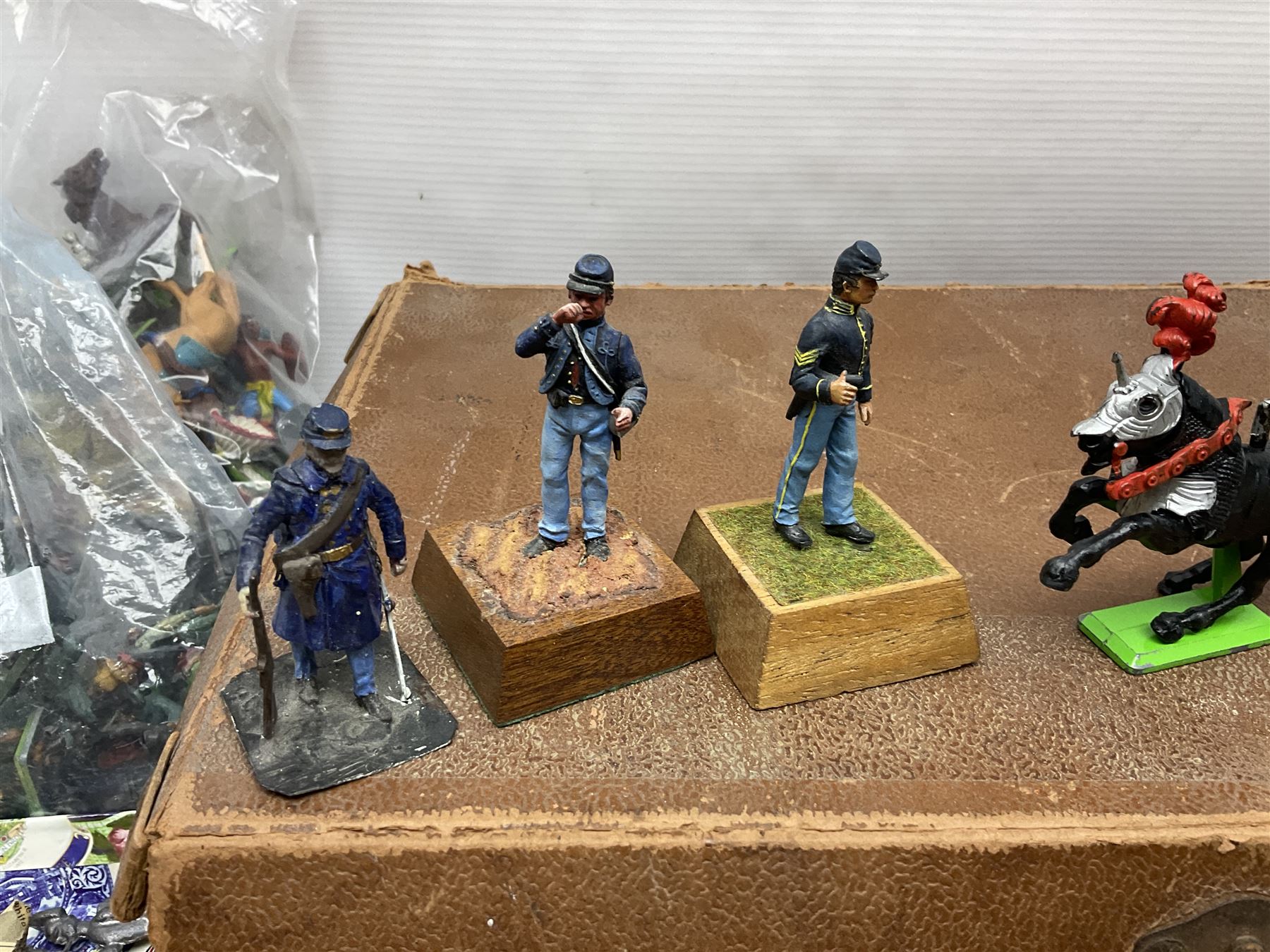 Large variety of predominantly metal miniature soldiers, a mixture of painted and non-painted figures, to include examples of American, British and European soldiers 