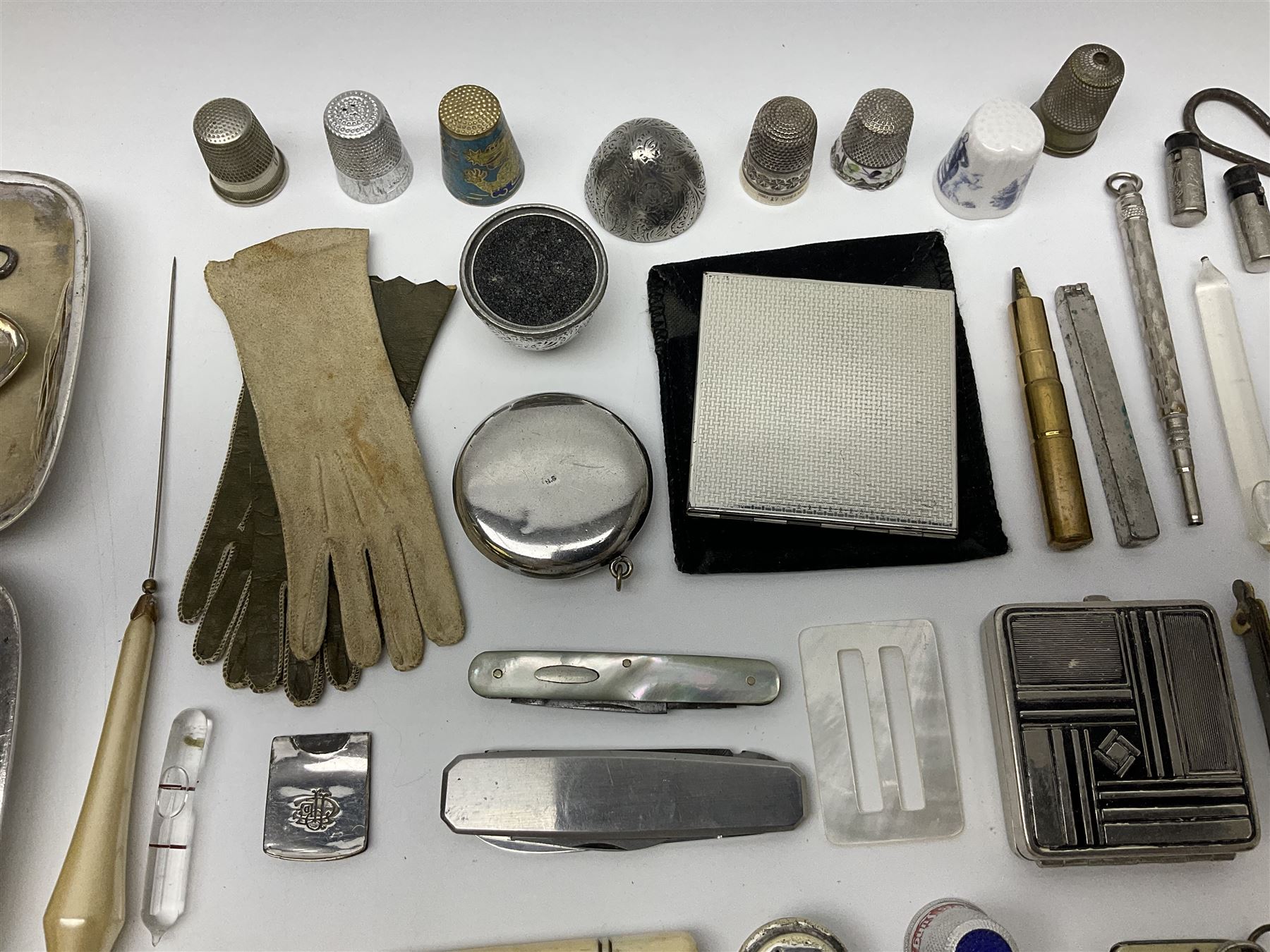 Pair of Wedgewood jasperware unicorn cufflinks, silver handled part manicure set, enamel flip notebook, dolls leather gloves, Stratton compact, and a collection of sewing accessories including thimbles, button hooks, thimble holder, scissors etc 