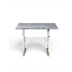Victorian cast iron garden table, rectangular slate top raised on pierced scrolling foliate end supports with urn and column designs, united by a spindle support stretcher with scrolling acanthus spandrels, stamped 'Registered Design' with indistinct number, in distressed white painted finish