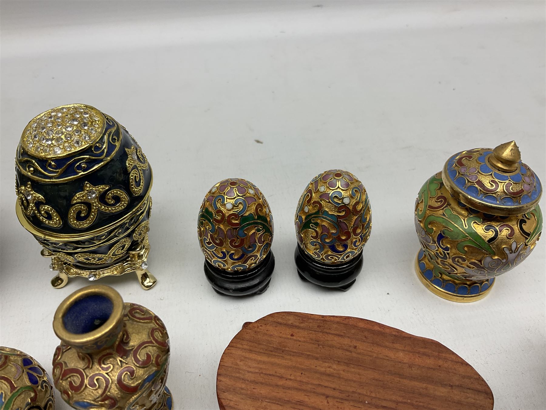 Chinese bronze peach of immortality and longevity, cloisonné vase of baluster form and three miniature cloisonné vases, six Netsuke modelled as monkeys, dragon etc