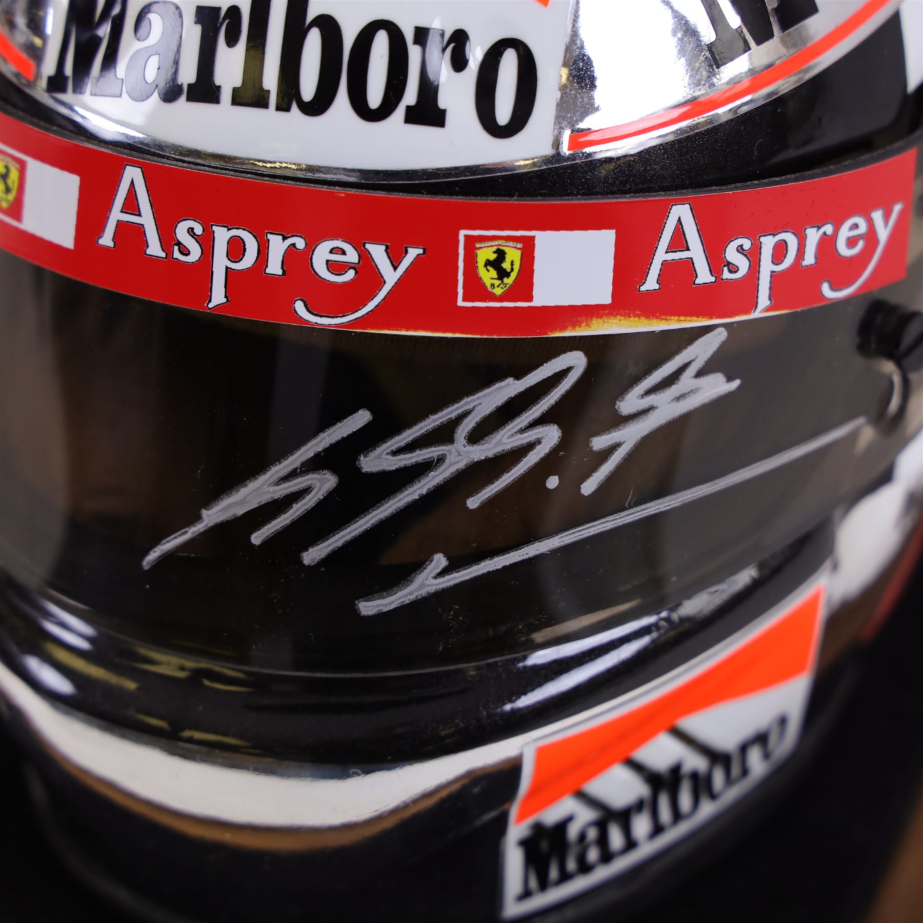 Half-size signed 1996 Michael Schumacher Ferrari helmet, signed at 2004 British Grand Prix, in display case with certificate of authenticity