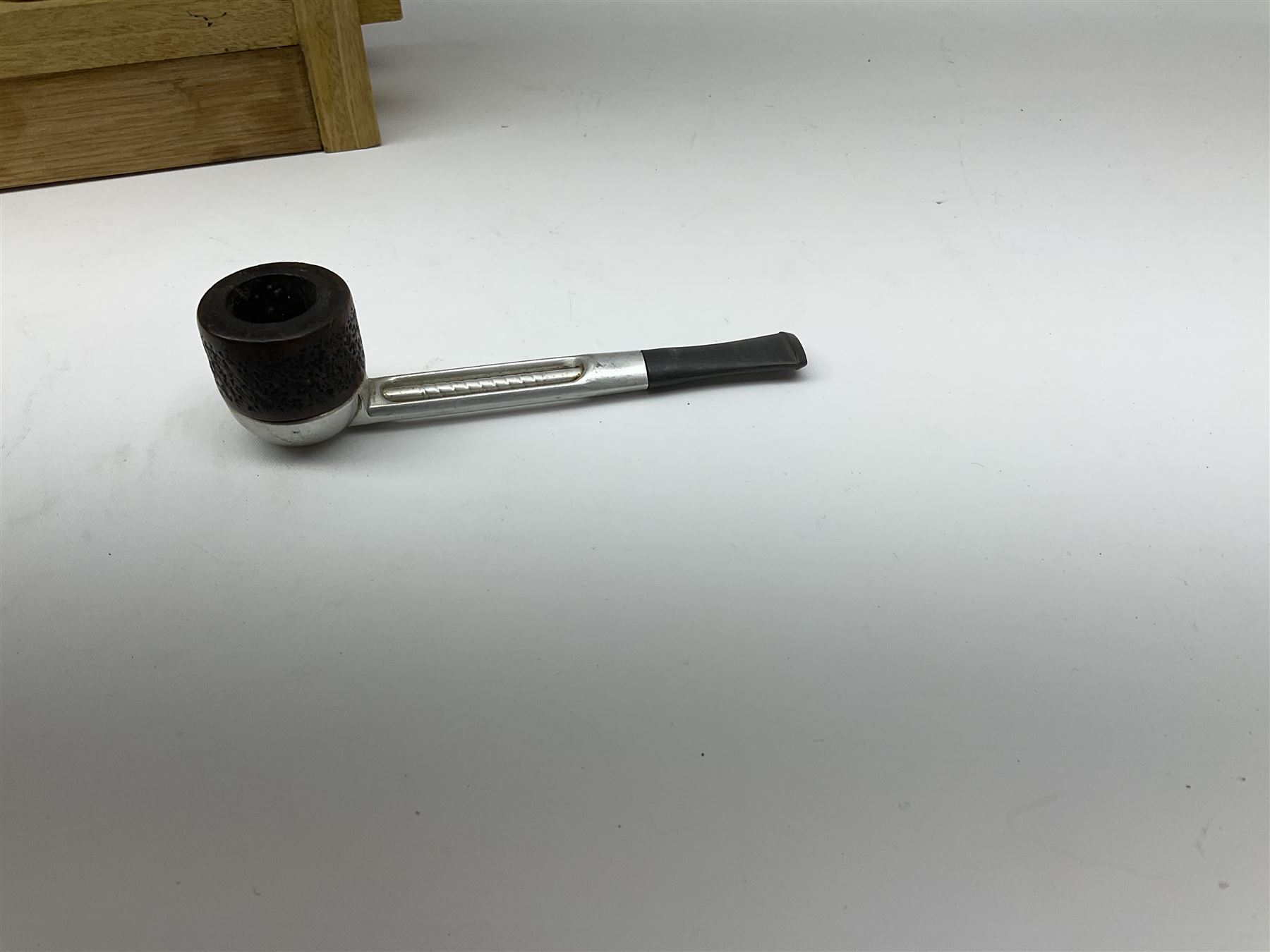 Pipes and two tiered wooden rack together with eleven pipers, including briar pipe carved as a wolf, Sea Dog straight pipe, John Brumfit pipe, meerschaum pipe ect, pipe rack H29.5cm