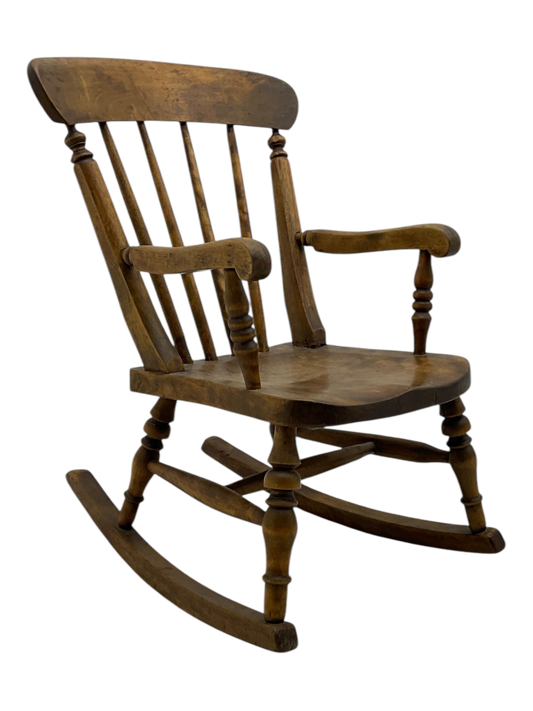 19th century child's rocking chair; heavily carved cuckoo clock; canal buckby can hand painted with floral motifs (3)