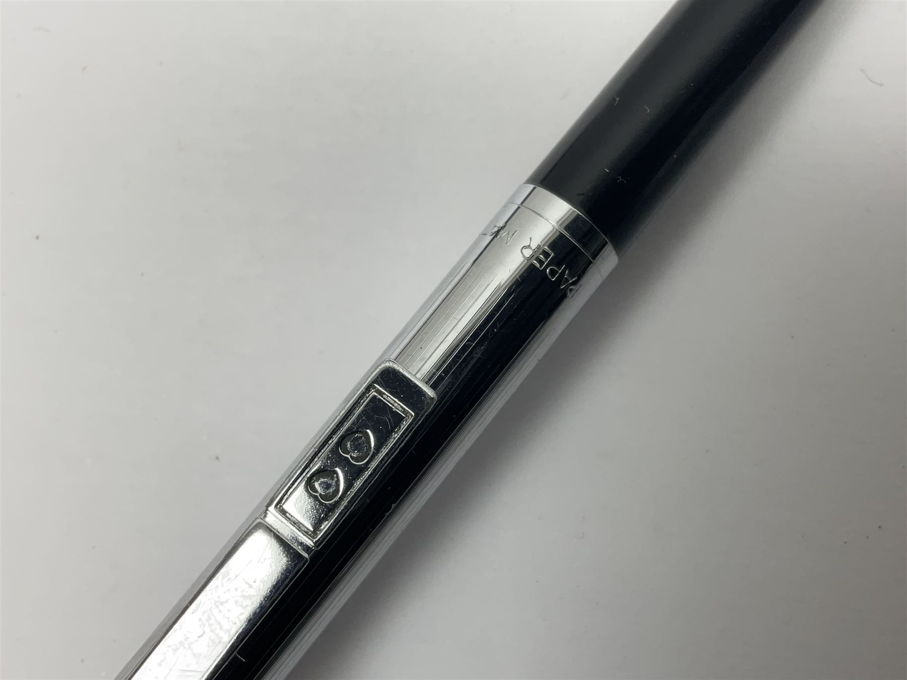 Three fountain pens, to include Conway Stewart 'Dinkie 550' and 'Conway 57' and a Parker 'Slimfold', all with 14ct gold nibs, together two roller ball pens, including a Parker example and a Swarovski Crystal paperweight