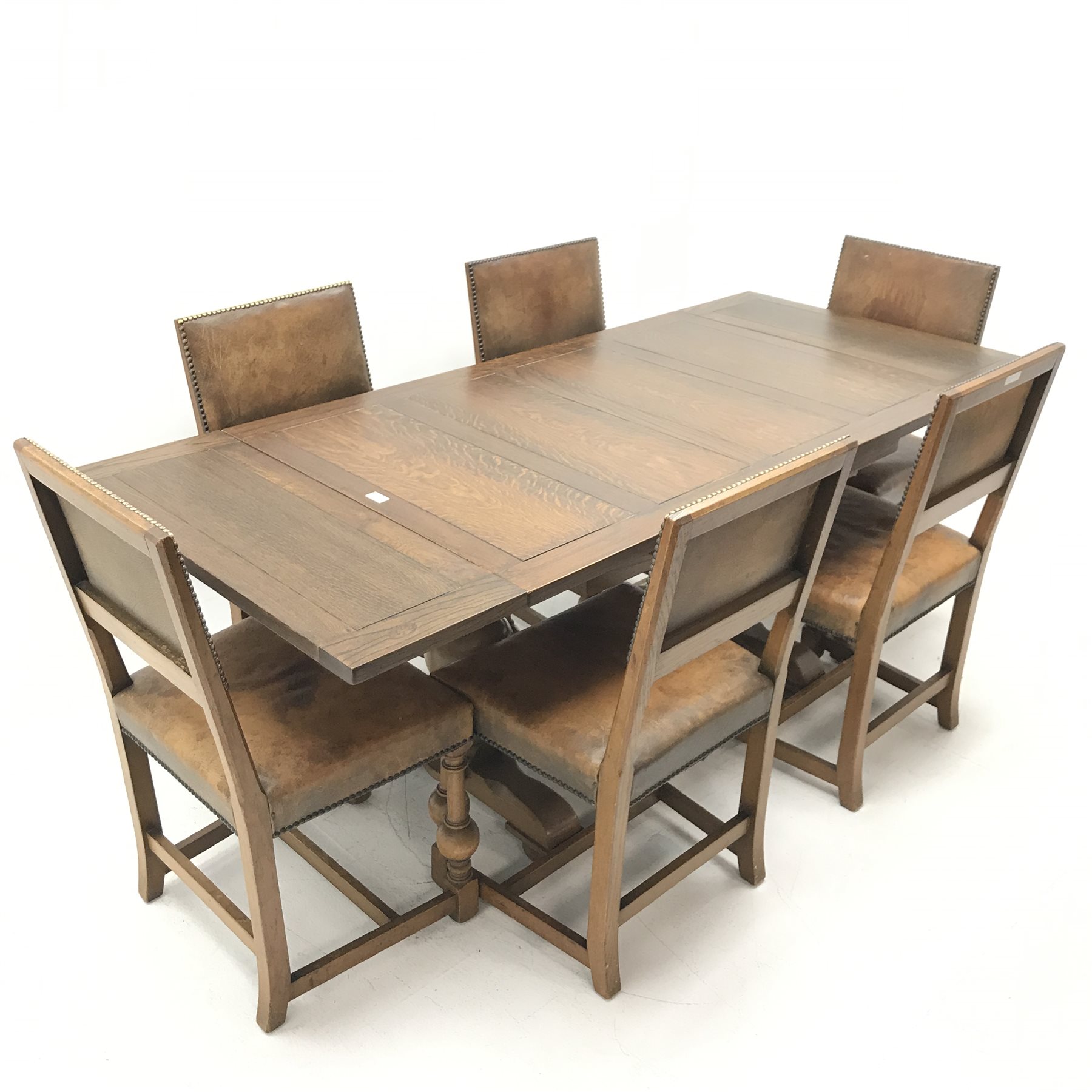 E. Gomme Ltd of High oak drawer leaf dining table, two baluster