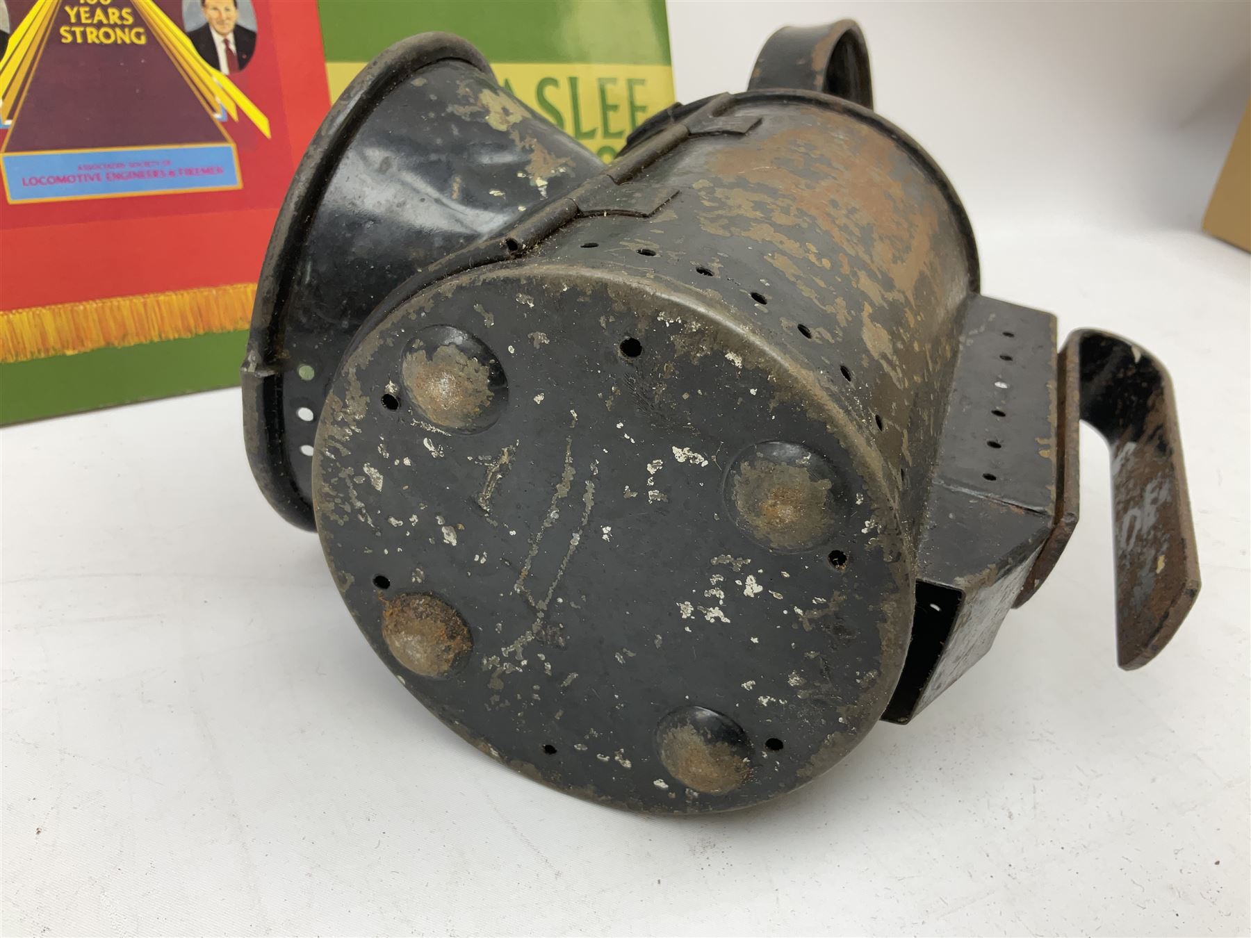 Black painted three colour railway lamp with revolving filters, H29cm; BR Acme Thunderer whistle; three railway peaked caps, two with BR Intercity 125 badge; small album of photographs of railway interest etc