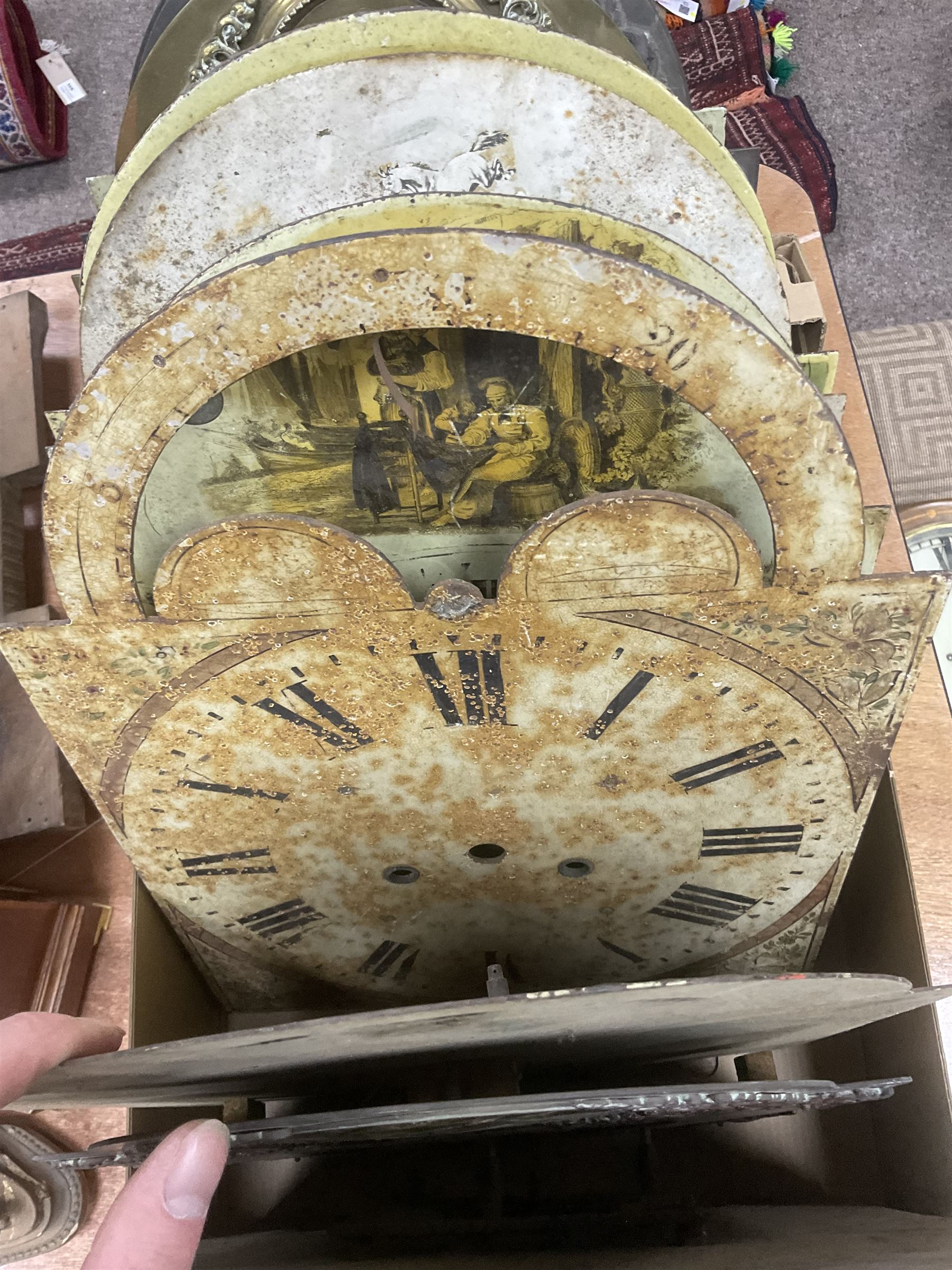 Approximately thirteen longcase clock faces, mainly 18th and 19th century, including brass and painted dials