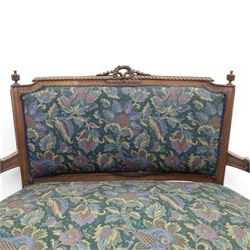 20th century French Louis XVI style stained beech two-seat salon settee, rectangular upholstered back and seat in floral tapestry fabric, carved and moulded frame with foliate cresting, padded open arms and fluted tapering supports