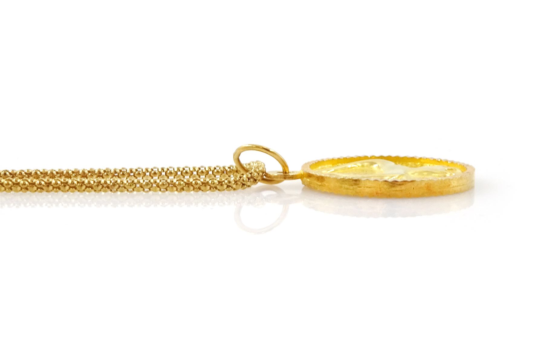 21ct gold Taurus pendant, stamped 875, on 18ct gold popcorn link chain necklace, stamped 750