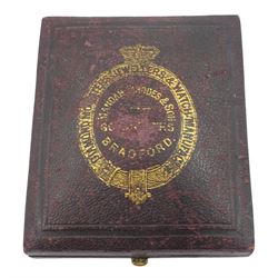 Victorian 18ct gold open face key wound fusee lever pocket watch by Rhodes & Son, Bradford, gilt dial with Roman numerals, case with engraved foliate decoration and cartouche, makers mark W K, London 1872, in fitted velvet and silk lined case