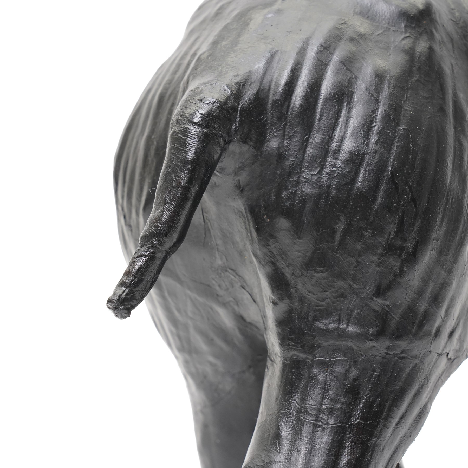 In the style of Liberty & Co - pair of 20th century ebonised papier mache elephants 