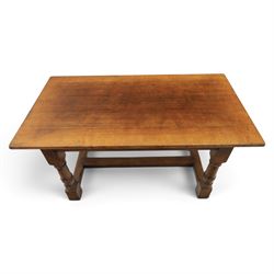 Titchmarsh & Goodwin style solid oak refectory table, rectangular top raised on block and turned supports united by a full length undertier