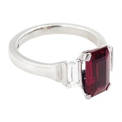 18ct white gold ruby and diamond three stone ring, single emerald cut Thai ruby of approx 2.00 carat, with a baguette cut diamond set either side, hallmarked, total diamond weight approx 0.60 carat