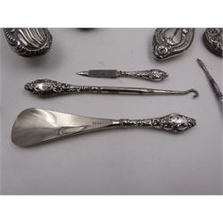 Group of silver mounted dressing table items, including two hand mirrors, two hairbrushes and a part manicure set, etc all with varying designs, all hallmarked