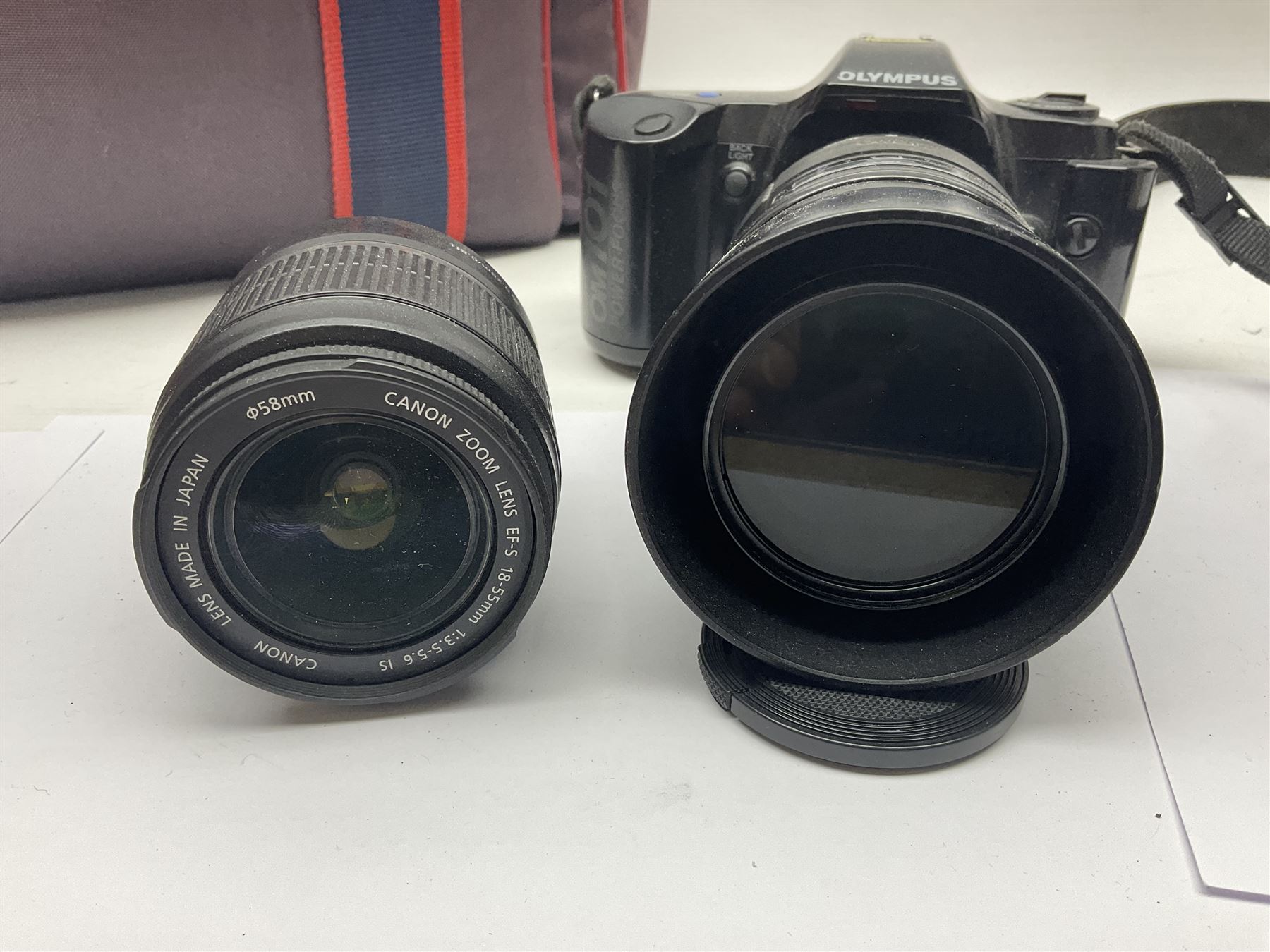 Cameras and accessories, to include Olympus OM101 Power Focus camera body, serial no 1076067, with 'Sigma AF Zoom 1:38, f=75 200mm' lens, serial no 2053714, Canon EOS 5000 camera body, serial no 1507812, with 'Canon Zoom EF 80-200mm, 1:4.5-5.6' lens, other cameras, by Miranda, Coronet and Ricoh and a collection of lenses, carry cases, etc 