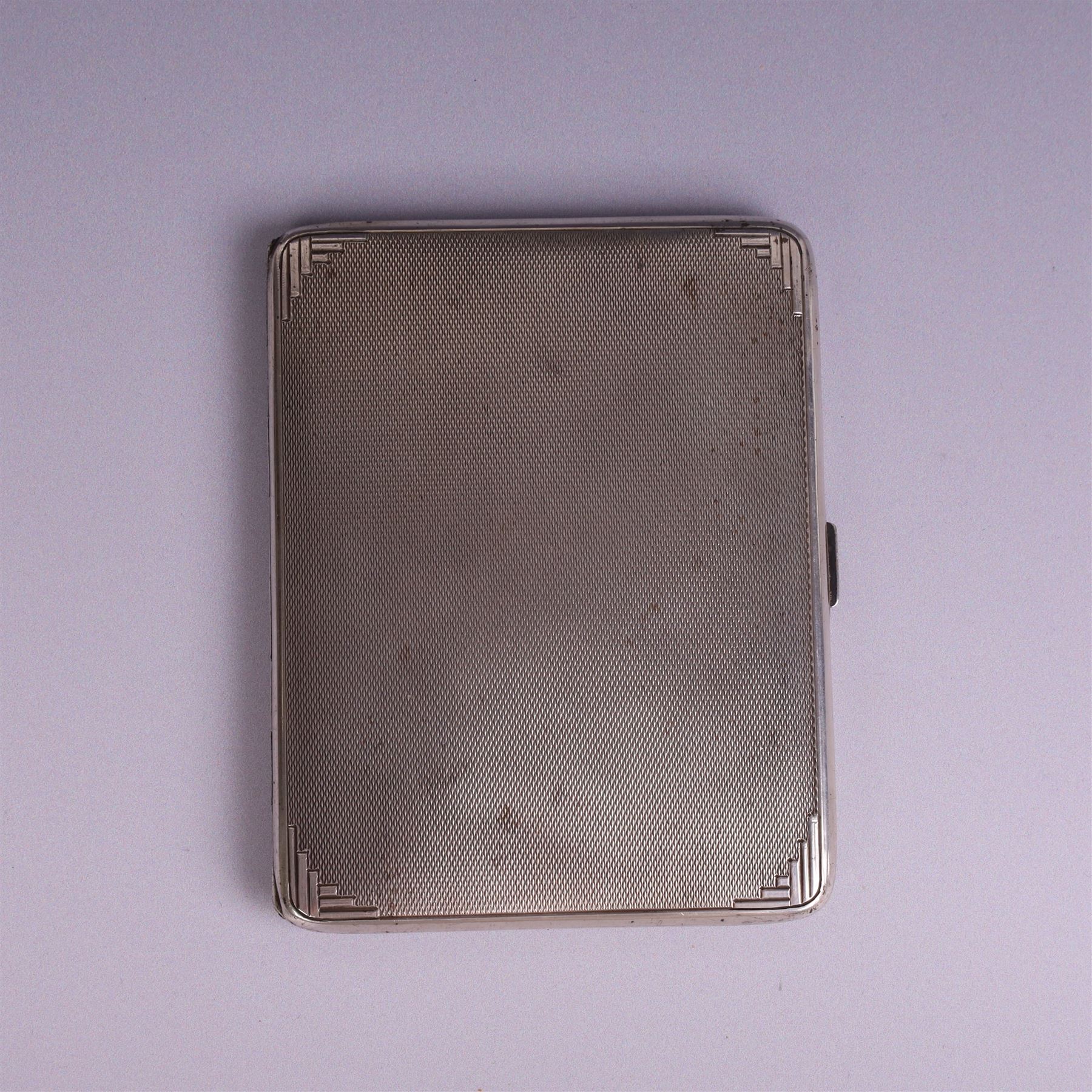 1930s silver cigarette case, of rectangular form with rounded corners, with engine turned decoration throughout, with personal engraving to interior, hallmarked Padgett & Braham Ltd, London 1931, L 11cm 