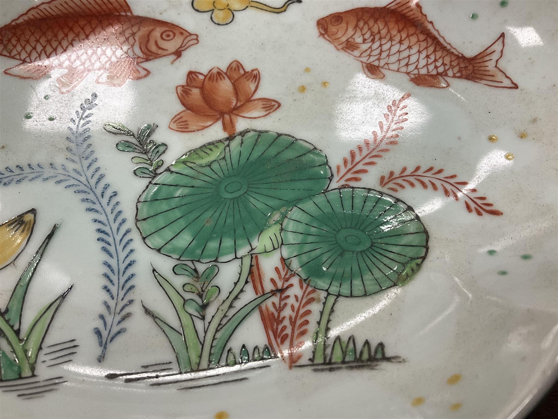 Oriental bowl of shallow form decorated with painted koi fish and sea plants, L25cm