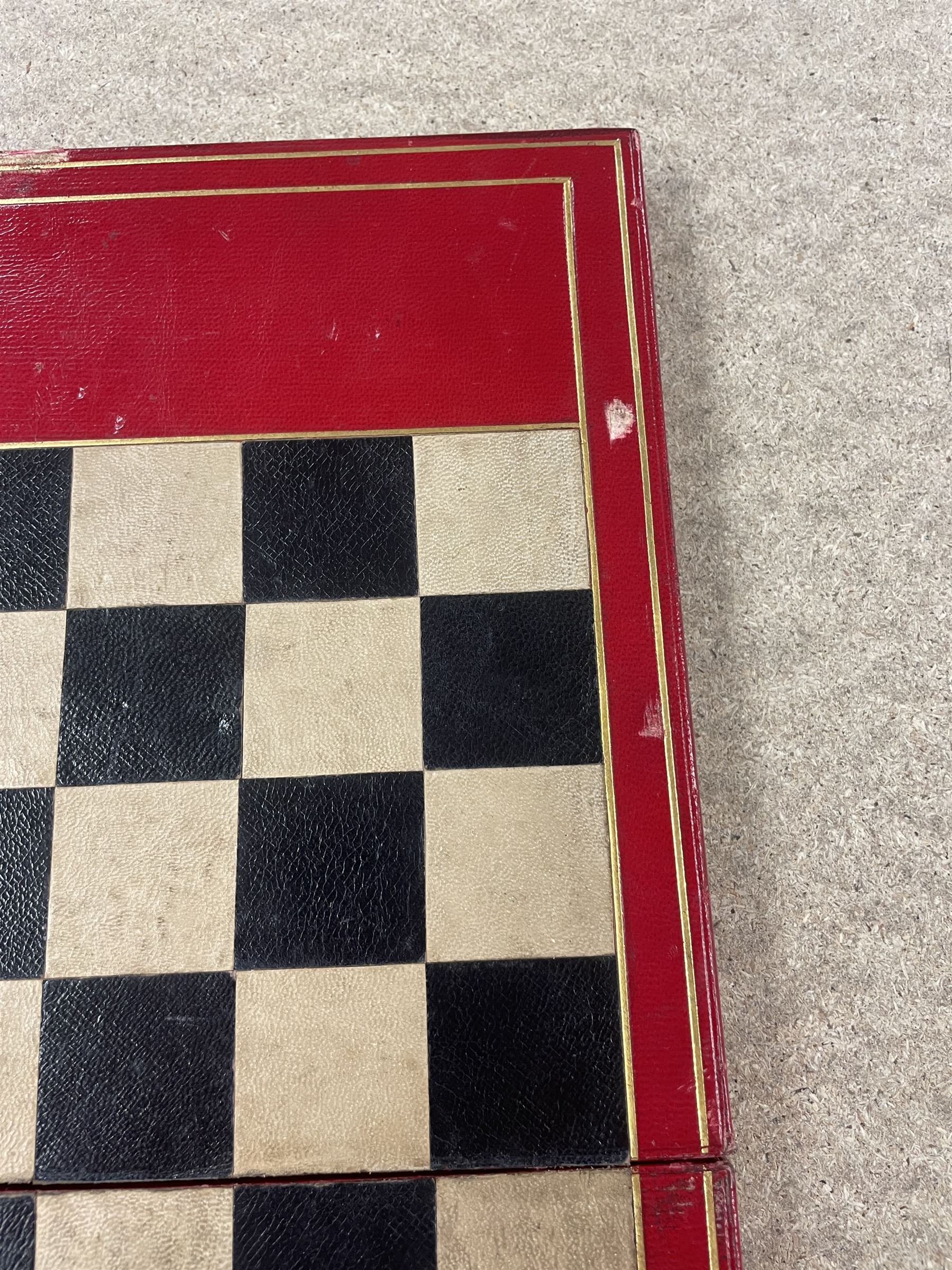 19th century walnut and brass bound games compendium box, painted to enhance the grain, of rectangular form, the hinged opening cover with rounded sides, central brass cartouche with engraved lion crest, and brass riveted straps, opening to reveal a red leather and blue silk lined compartmented interior, with fold-down games board, and lift-out tray containing playing cards, ebony turned dice towers, white and red stained bone draughts, and chess pieces, ivory dice, and ivory and ebony whist markers, and brass bezique board, cribbage board and markers, H15cm W32cm D24cm
This lot has been registered for sale under Section 10 of the APHA Ivory Act