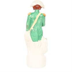 Rare mid 19th century Staffordshire pottery figure of Admiral Lord Nelson, modelled standing in uniform with green tunic, beside anchor, H27cm