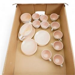 Poole pottery Twintone seagull and peach part coffee service, comprising ten cups and twelve saucers, two sugar bowls and a cream jug and stand