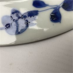 Japanese Meiji period Arita blue and white plate, of circular form, painted with riverside landscape and bird upon flowering branch, with character mark beneath, D24.5cm, together with two 18th century Chinese blue and white plates, each painted with floral design, each approximately D22.5cm
