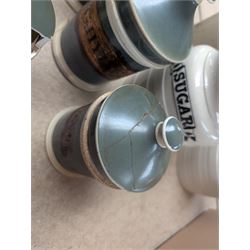 19th century sage green apothecary jars with gilt labels, four white ceramic kitchen jars and a stoneware flaggon marked Wheat Wine
