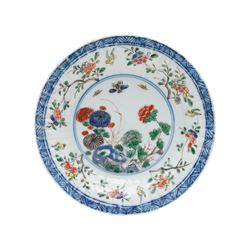 Two Chinese Kangxi period famille verte cafe au lait saucers, decorated with native animals among foliage, with indistinct mark within double rings beneath, D14cm 