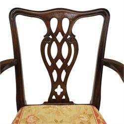 Large 19th century mahogany extending dining table with set of Chippendale design chairs, extending dining table with rectangular moulded top additional three leaves, raised on turned supports terminating in brass castors, the dining chairs (2 + 2) with shaped cresting rail and pierced splats, raised on square supports with stretchers