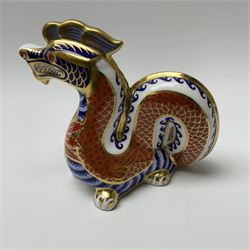 A Royal Crown Derby paperweight, modelled as a dragon and decorated in the Imari pallet, with gold stopper and makers box. 