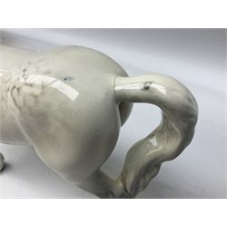 Collection of Beswick horses, including grey horse no.701, palomino foal no 836, grey stocky jogging mare no.855 etc, together two Royal Doulton horses, (8)