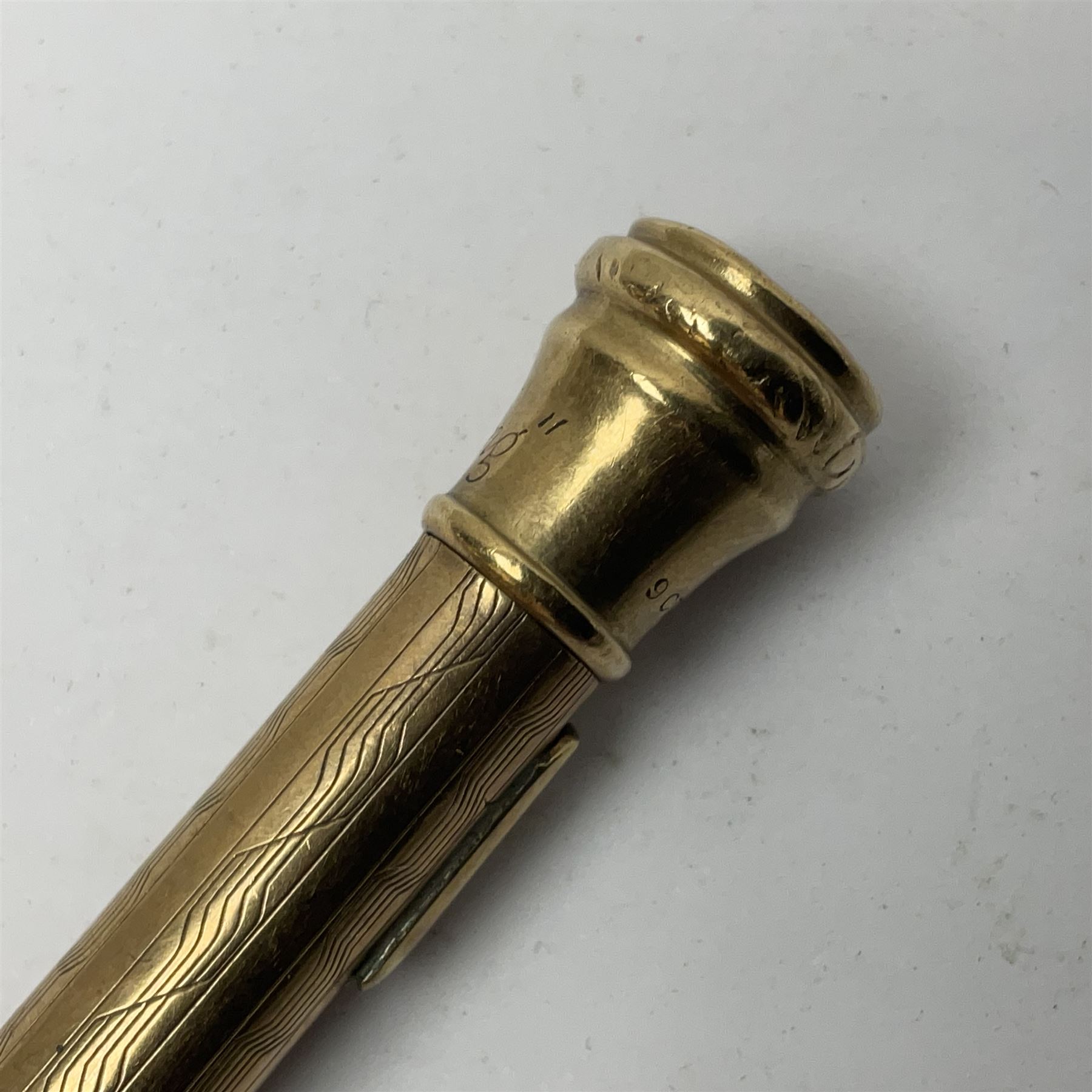 9ct gold 'Lifelong' propelling pencil, with engine turned decoration, stamped 9ct 