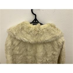 Brown mid length musquash fur coat by National Fur Company together with white rabbit cape