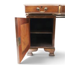 D Matthews & Son Office Furnishers (Liverpool) - Edwardian mahogany twin pedestal partners desk, rectangular top with inset green leather writing surface, fitted with an assortment of twelve drawers with brass swan neck handles, the pedestals with cupboards fitted to the opposing side, raised on ogee bracket feet