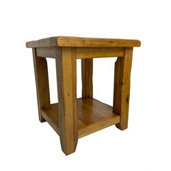 Pair of oak lamp or bedside tables, square top raised on square supports, united by undertier