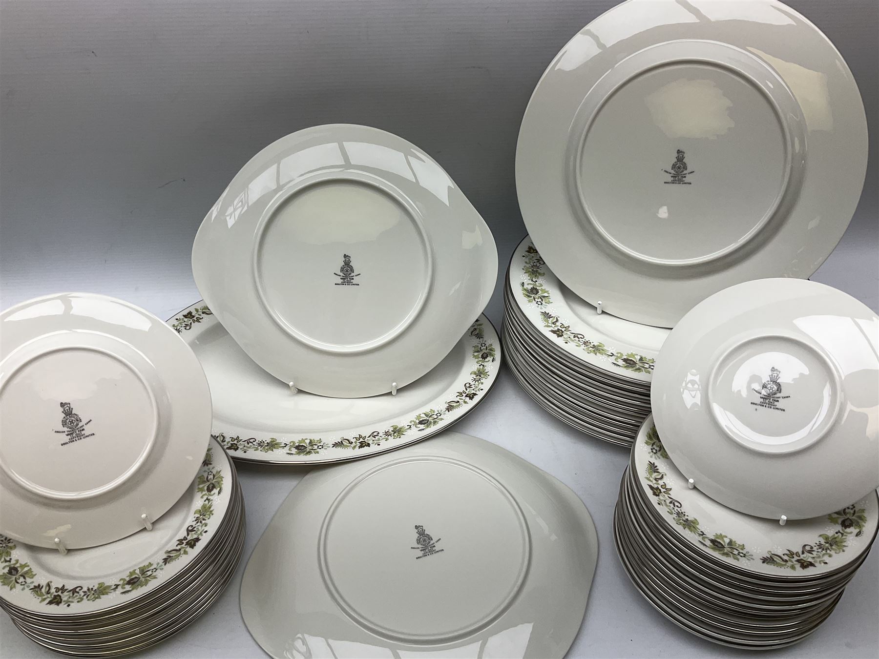 Royal Doulton tea and dinner wares decorated in the Vanity Fair pattern, to include twelve dinner plates, twelve side plates, eleven bowls, three lidded tureens, ten teacups, sauceboat on stand etc, together with boxed Royal Worcester plate, six Royal Worcester ramekins etc