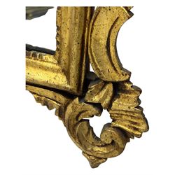 18th century design gilt framed wall mirror, within a pierced and scrolling foliate frame, leaf sprays and flowerhead cresting