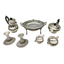 Collection of silver plate to include pair of Falstaff dwarf candlesticks in the 'Adam' style, weighted and raised upon fluted oval bases, together with Walker & Hall coffee pot, teapot, twin handled sucrier and jug in pattern no. 53602, and a Finnigans of Manchester entrée dish, the revolving top with engraved monogram