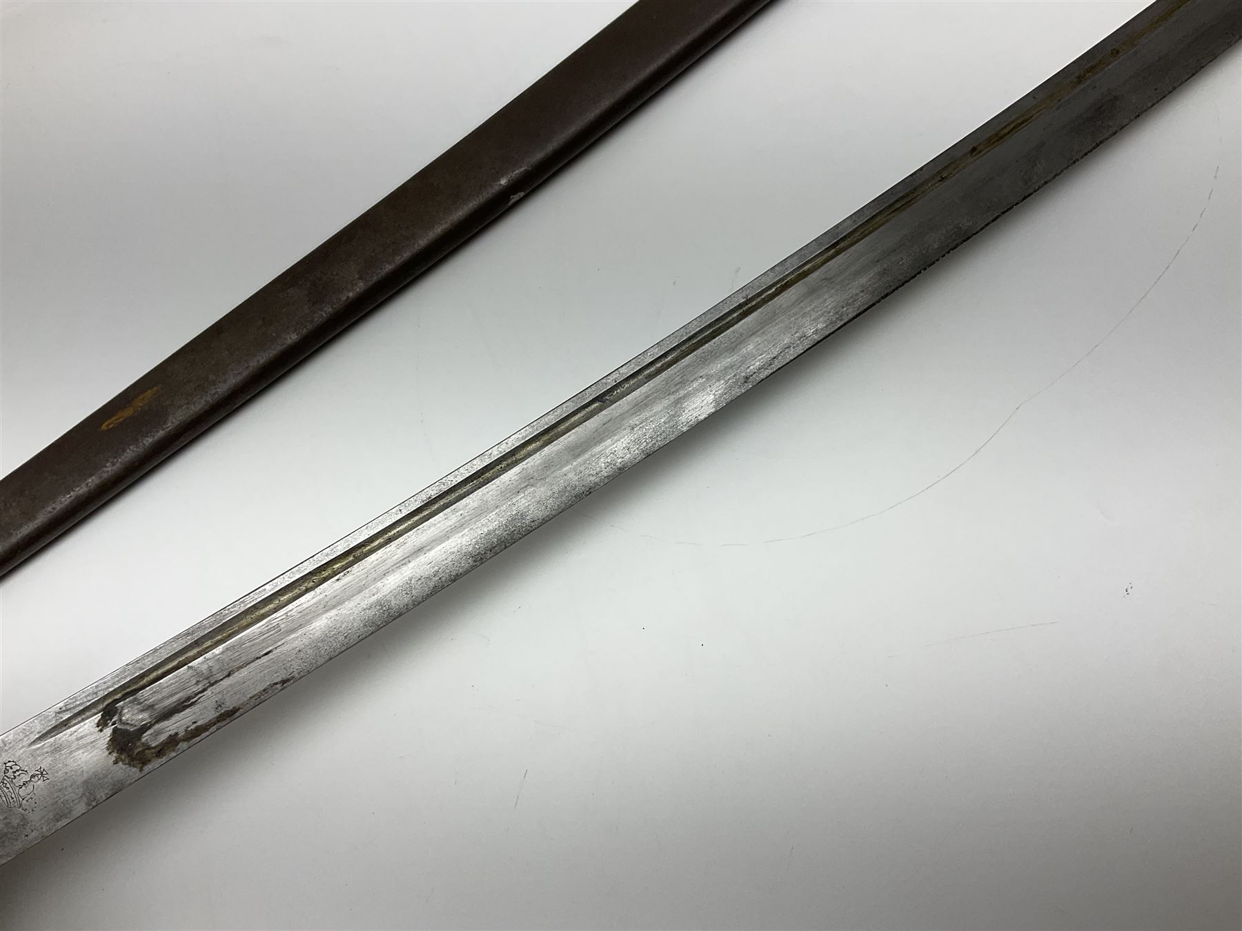 19th Century German (Saxony) Cavalry Sword, the 90.5cm single edge curved steel blade with narrow fuller to the back edge at each side, engraved with a crowned AR monogram and coat of arms, stamped with crowned AR, the back edge engraved C.v Keller im Solingen 1862, the brass half basket hilt with three flat curved bars, applied badge missing, marked G.R. 4, with ribbed leather covered grip and leather finger strap; in steel scabbard with two fixed suspension rings to one side and stamped G.R. II 118; L109.5cm overall