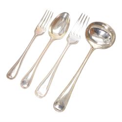 Oak table top canteen cabinet, the top with inset vacant brass cartouche, with pair of panelled doors opening to reveal four interior drawers with inset brass handle, containing a selection of silver plated flatware, 29cm x 40cm x 51cm