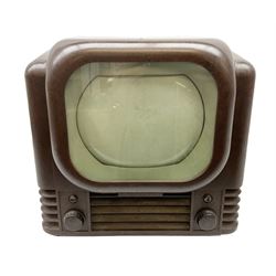 1950s Bush Type TV22A Bakelite Television receiver, the TV cased in marbled brown Bakelite of stepped form, the 9 inch screen with white mask, with original cover casing to reverse and 